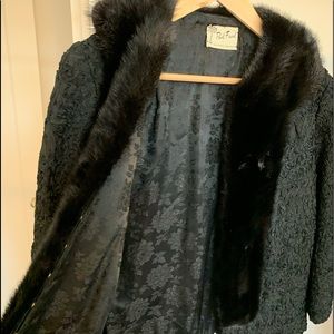 Dinner jacket with fur collar and scalloped hem.